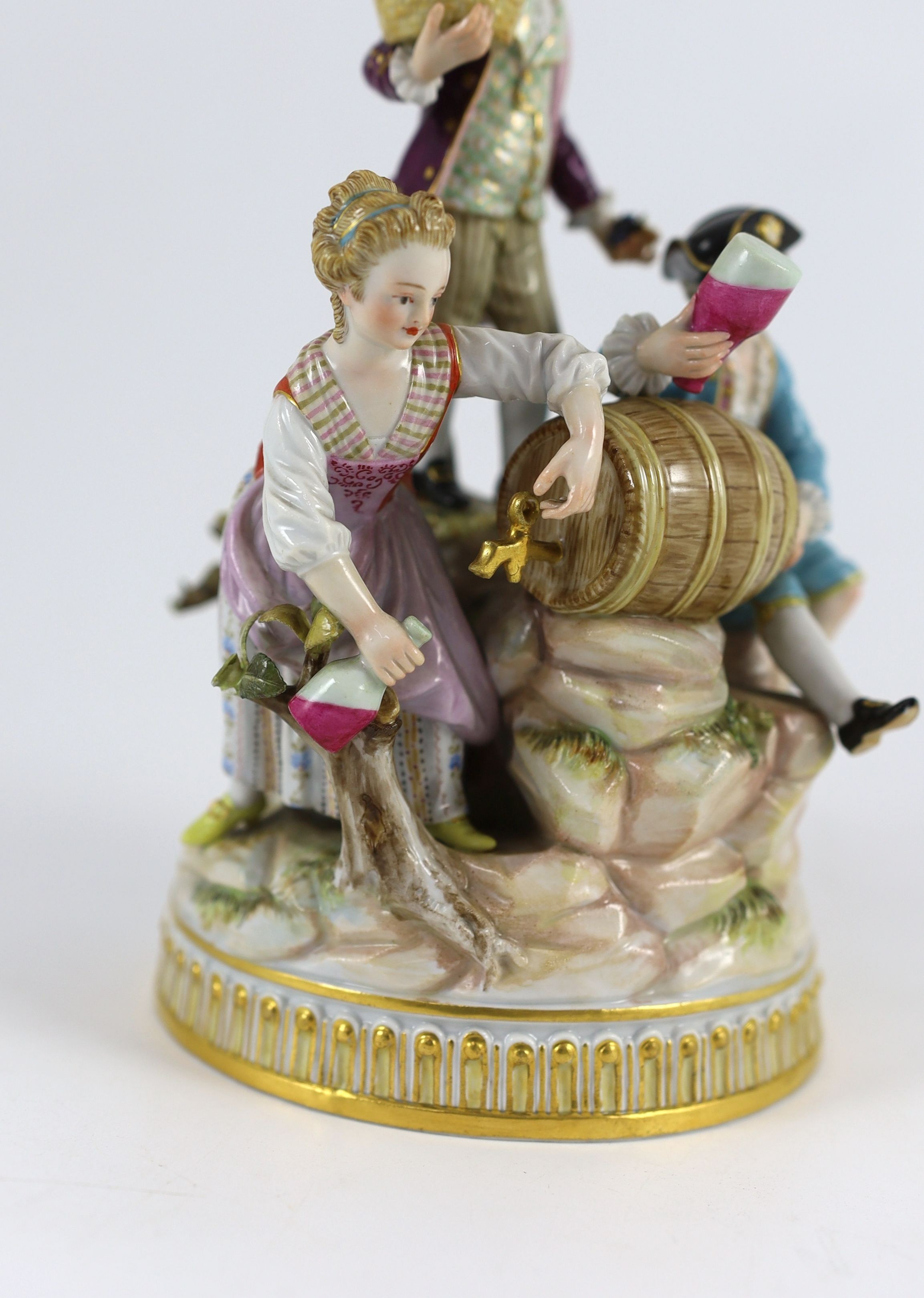 A Meissen group of the three winemakers, 19th century, after a model by Michel Victor Acier, 21 cm high